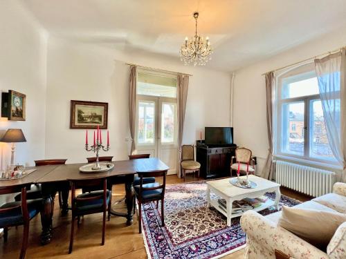 a living room with a table and a couch at Wägner´s Heim in Dresden