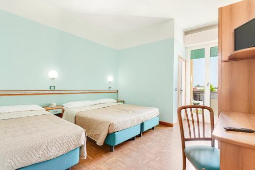 Postel nebo postele na pokoji v ubytování Hotel Fantini