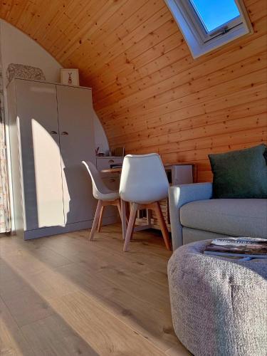 a living room with a couch and a table at Finest Retreats - Hundle Dale in York
