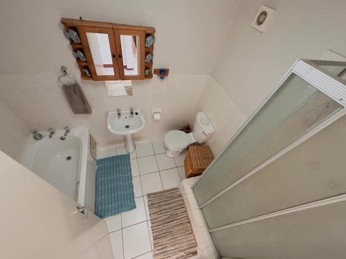 an overhead view of a bathroom with a tub and sink at Laguna La Crete 216, Beach Front Holiday Apartment in Margate
