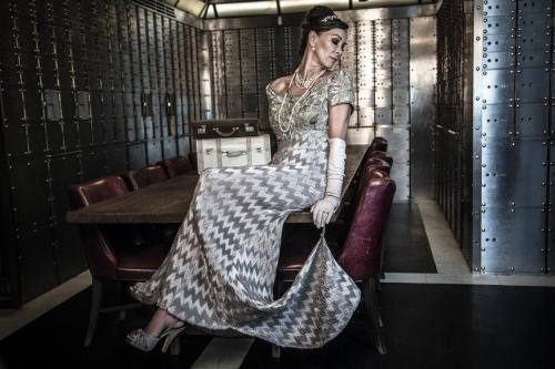 a woman sitting on a chair in a room at Hotel Gotham in Manchester