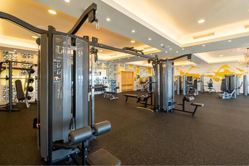 a gym with several treadmills and machines at ON Hotels Oceanfront Adults Designed in Matalascañas