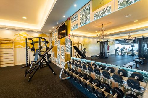 a gym with treadmills and weights in a room at ON Hotels Oceanfront Adults Designed in Matalascañas