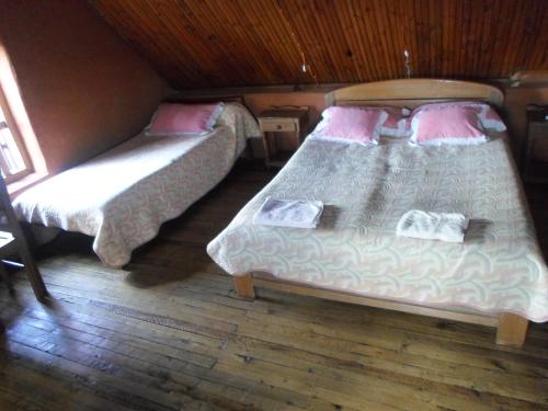 a bedroom with two beds in a room at Le Karthala Chambres D'Hotes in Antananarivo