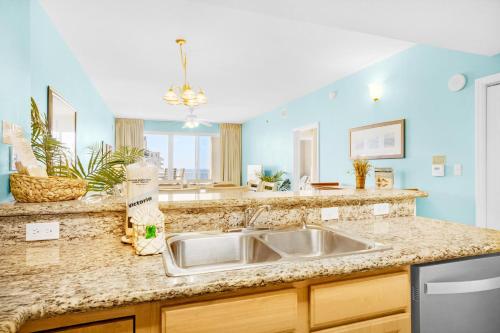 a kitchen with a sink and a counter at Ariel Dunes I 1502 in Destin