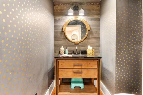 a bathroom with a sink and a mirror at Designer 3 BR Townhome with Beautiful Backyard in Philadelphia