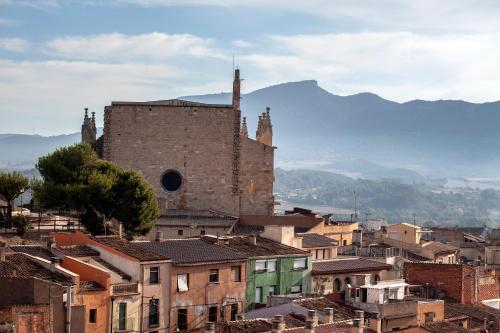 a view of a city with a castle and buildings at Casa Maro Prenafeta in Prenafeta