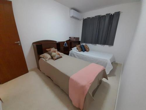 Posteľ alebo postele v izbe v ubytovaní Apartamento inteiro pé na areia