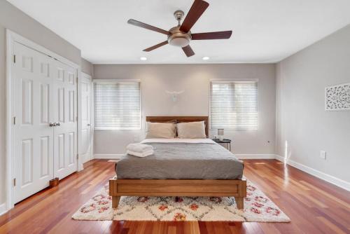 a bedroom with a bed and a ceiling fan at Society Hill 4 Bedroom with Garage Parking in Philadelphia