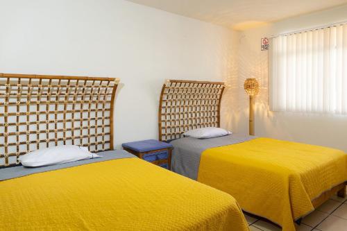 Кровать или кровати в номере La Créme de la Créme Hostel