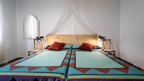 Giường trong phòng chung tại Casa, playa y jardín