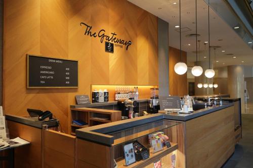 a fast food restaurant with a sign on the wall at ANA Crowne Plaza Narita by IHG in Narita