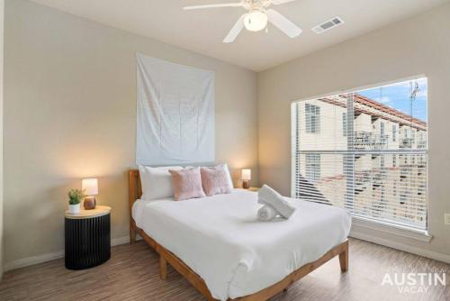a bedroom with a large bed with a window at Space for 8 Near Downtown Easy Walk to UT Campus in Austin