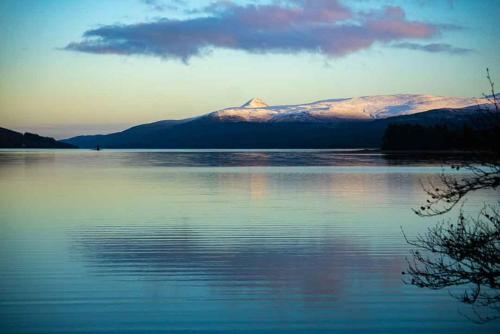 a view of a lake with a mountain in the background at Loch Rannoch Hotel and Spa in Kinloch Rannoch