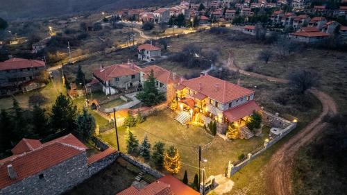 an aerial view of a large house with a yard at Ξενώνας Φωταξία in Palaios Agios Athanasios