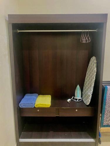 a wooden shelf with two towels on it at Mutiara Chalet Bandar Melaka in Melaka