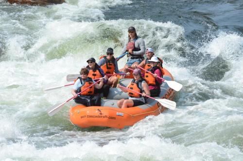 a group of people on an orange raft in the water at Candlewood Suites Boise-Meridian by IHG in Meridian