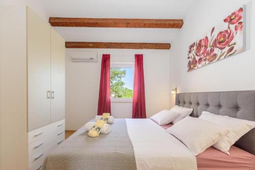 Tempat tidur dalam kamar di Villa Dada, Žminj, Istria