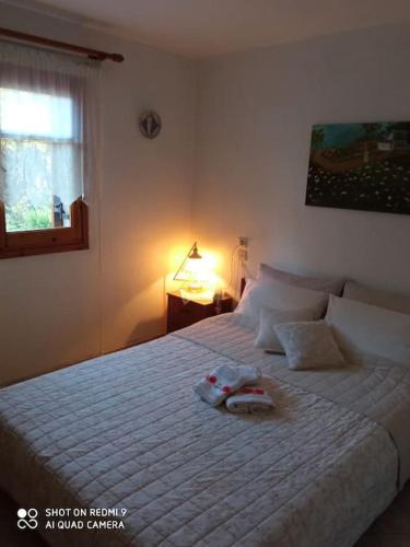 a bedroom with a bed with a stuffed animal on it at Persefoni's Traditional House in Promírion