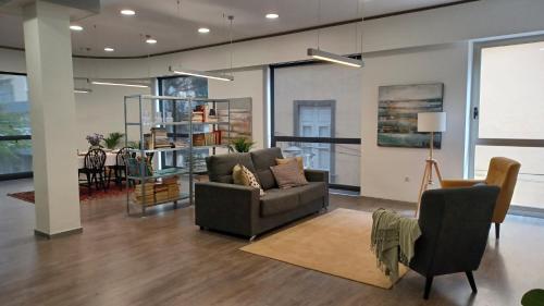 a living room with a couch and a table at NEW CENTRAL LOFT- El verodal de Sabino in Santa Cruz de Tenerife