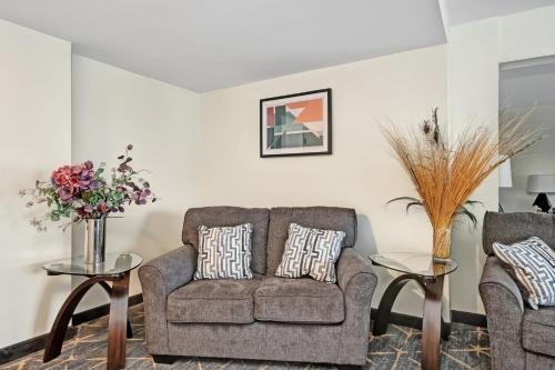 a living room with two chairs and a couch at Holiday Inn - Piscataway - Somerset by IHG in Piscataway