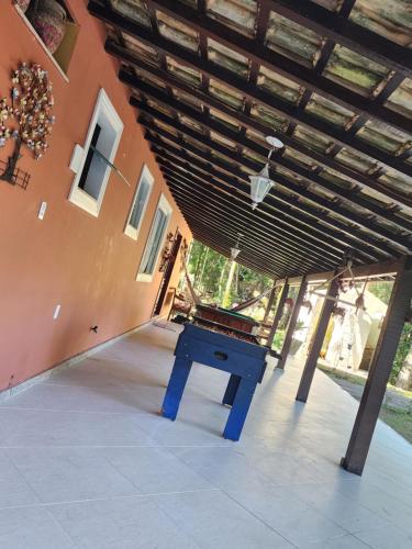 a ping pong table sitting inside of a house at Sítio Donana Sana in Macaé