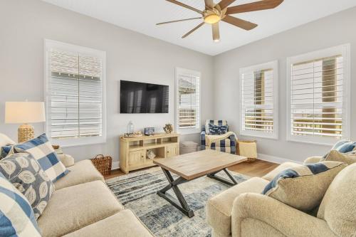 a living room with a couch and a table at Fishermans Delight home in Port Bolivar