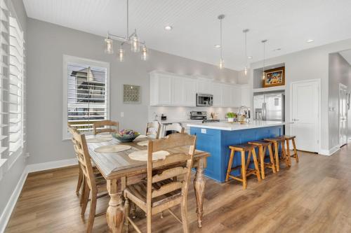 a kitchen and dining room with a table and chairs at Fishermans Delight home in Port Bolivar