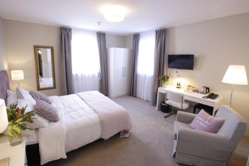 In de Witte Dame Hotel Bar Kitchen Apartmentsにあるベッド