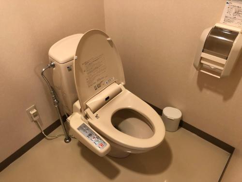 a bathroom with a toilet with an electronic device on it at Aizu Kogen International Human Resources Center - Vacation STAY 34901v in Minamiaizu