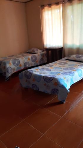 Cabinas las Gemelas tesisinde bir odada yatak veya yataklar