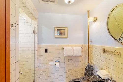 a bathroom with a shower and a sink at Firehouse 17 in Portland