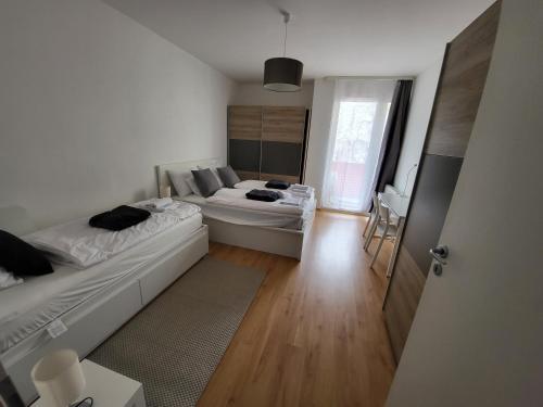 Posteľ alebo postele v izbe v ubytovaní SDP Futo Apartment