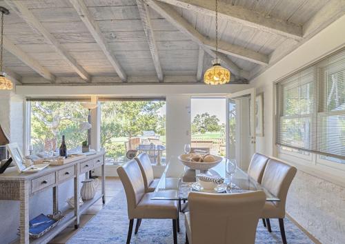 a dining room with a table and chairs at 3786 Adobe by the Sea home in Pebble Beach