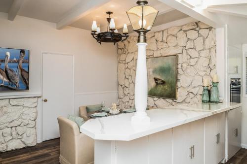 a kitchen with a stone wall and a chandelier at 3798 Cedar Place apts in Carmel