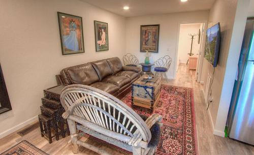 a living room with a leather couch and a table at Awesome Dawson condo in Stateline