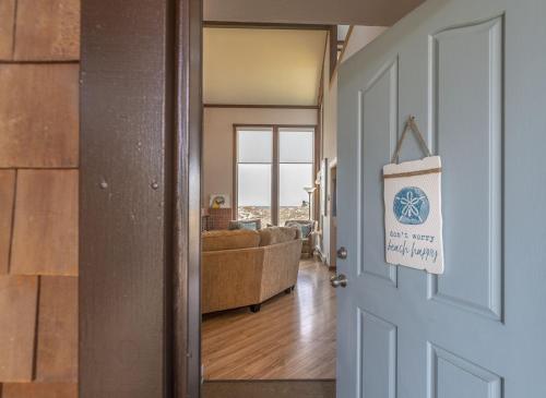 a door leading to a living room with a couch at 3823 Sand Dollar House condo in Castroville