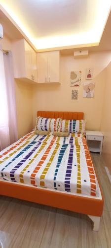 Una cama o camas en una habitación de Mistow BriaMagenta Condo