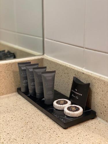 a shelf with a row of products on a counter at Brooklands Of Mornington in Mornington