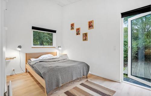 a white bedroom with a bed and a window at Cozy Home In Bjerringbro With Wifi in Bjerringbro