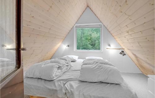 a bed in a room with a large window at Cozy Home In Bjerringbro With Wifi in Bjerringbro