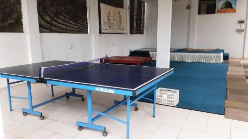a ping pong table in a room with at Challet Baitul Hanan with Private Pool near KLIA in Sepang