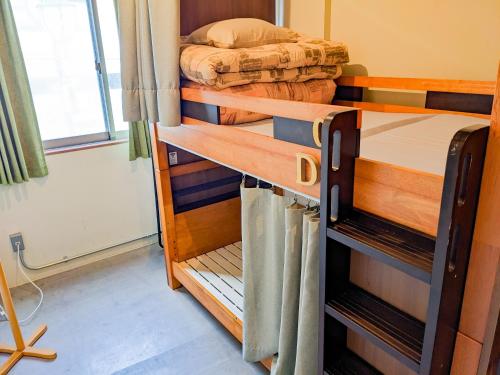 Postel nebo postele na pokoji v ubytování Hostel JIN