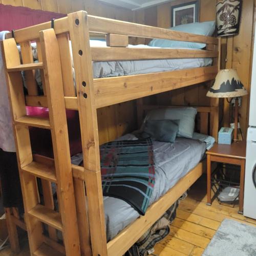 a couple of bunk beds in a room at Outlaw Cache in Chama