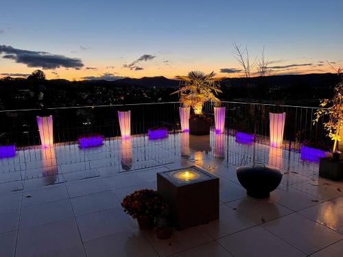 a view of a patio with pink and purple lights at perfect lifestyle Design Boutique & Private SPA in Gebenstorf