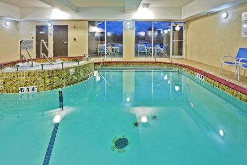 a large swimming pool in a hotel room at Holiday Inn Express Hotel & Suites Woodward Hwy 270, an IHG Hotel in Woodward