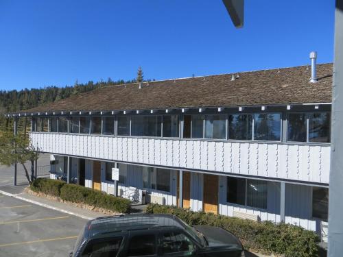 a car parked in front of a building at Americas Best Value Inn Tahoe City in Tahoe City