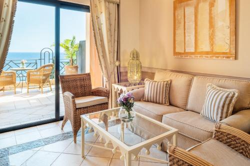 a living room with a couch and a table at Iberostar Grand El Mirador - Adults Only in Adeje