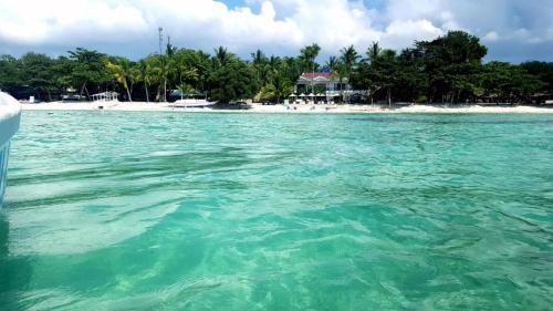 a view of a beach from a boat in the water at Villa Umi Panglao Resort in Panglao