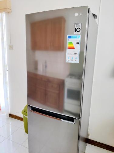 a stainless steel refrigerator in a kitchen at Coconut Bay Apartments in Flic-en-Flac